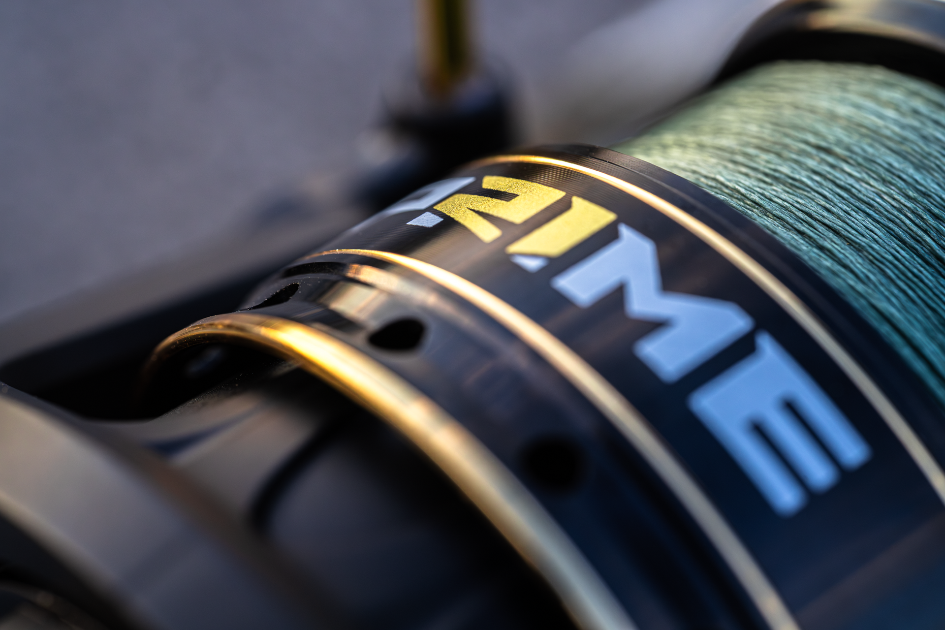 Close-up of the Abu Garcia + PRIME21 Collaboration black Spinning Reel. 