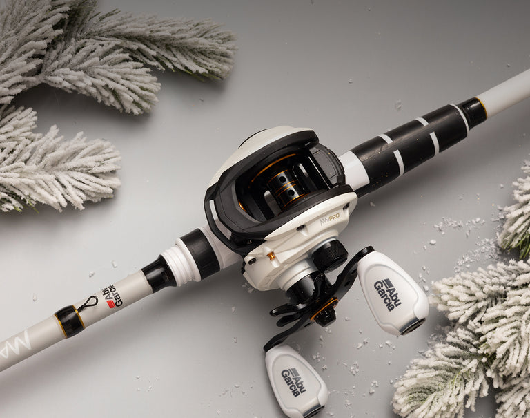 Abu Garcia Fishing combo a gray surface with decorative elements like white pine