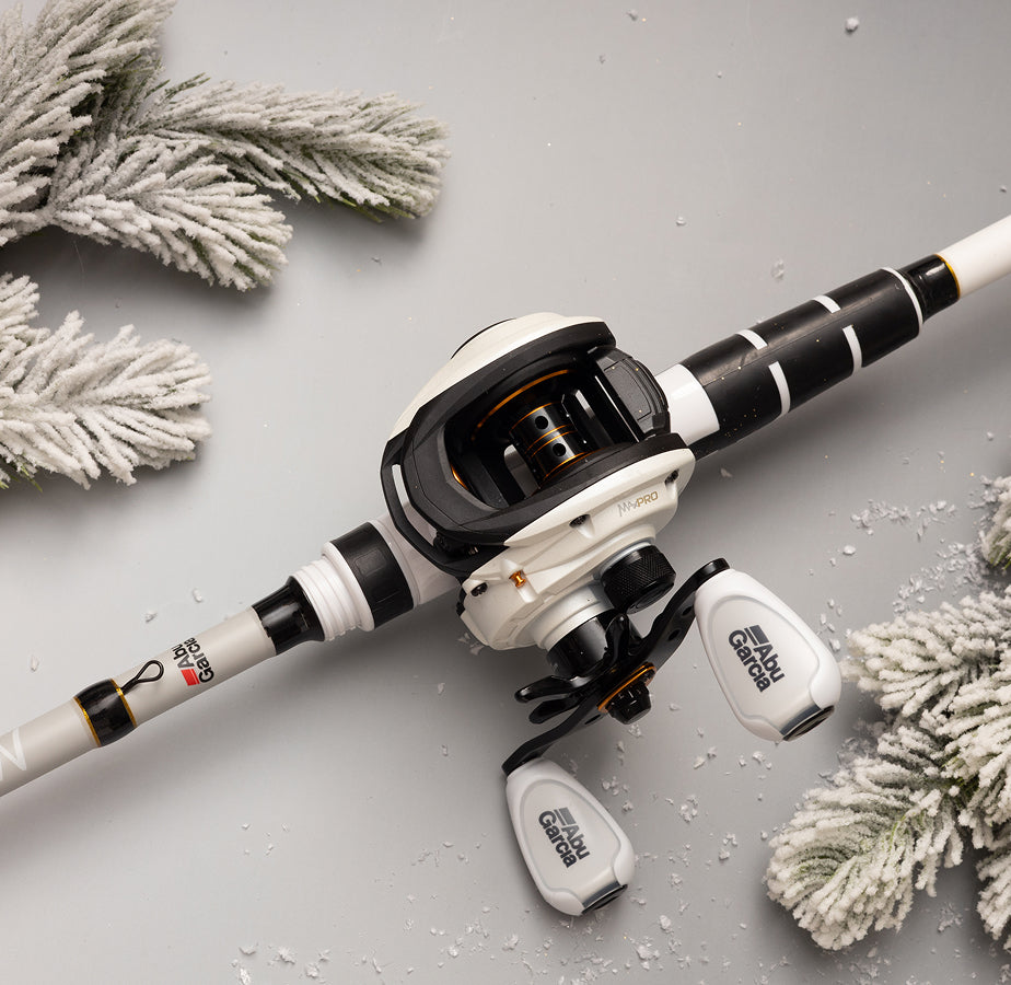 Abu Garcia Fishing combo a gray surface with decorative elements like white pine