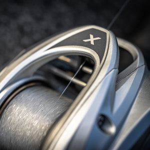 Close-up of a Revo® X VoltiQ™ Low Profile Reel with a blurred background