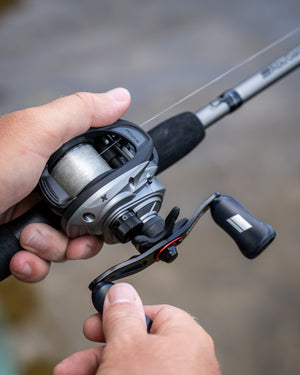 Abu Garcia Max X Low Profile Baitcast Combo in persons hand. 
