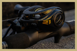 Close-up of a fishing reel with a blurred background
