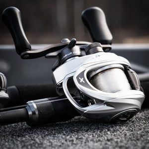 Close-up of a fishing reel with a blurred background